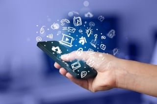 Hand holding smartphone with media icons and symbol collection-103864-edited.jpeg
