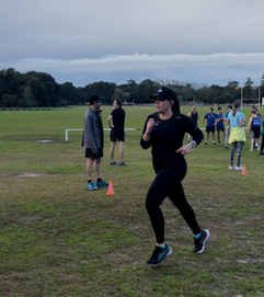 A person running on a field

Description automatically generated